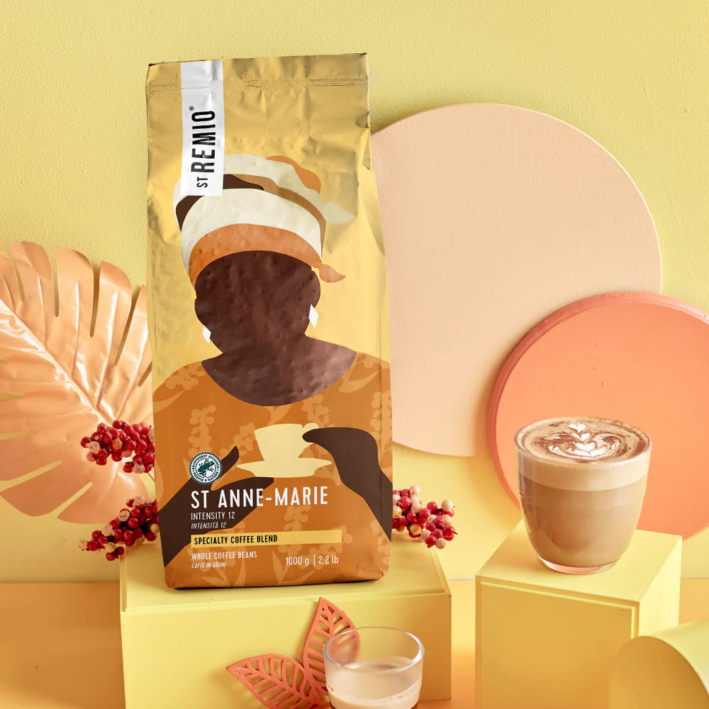 St Remo St Anne-Marie coffee bag with a cup of coffee on a yellow background