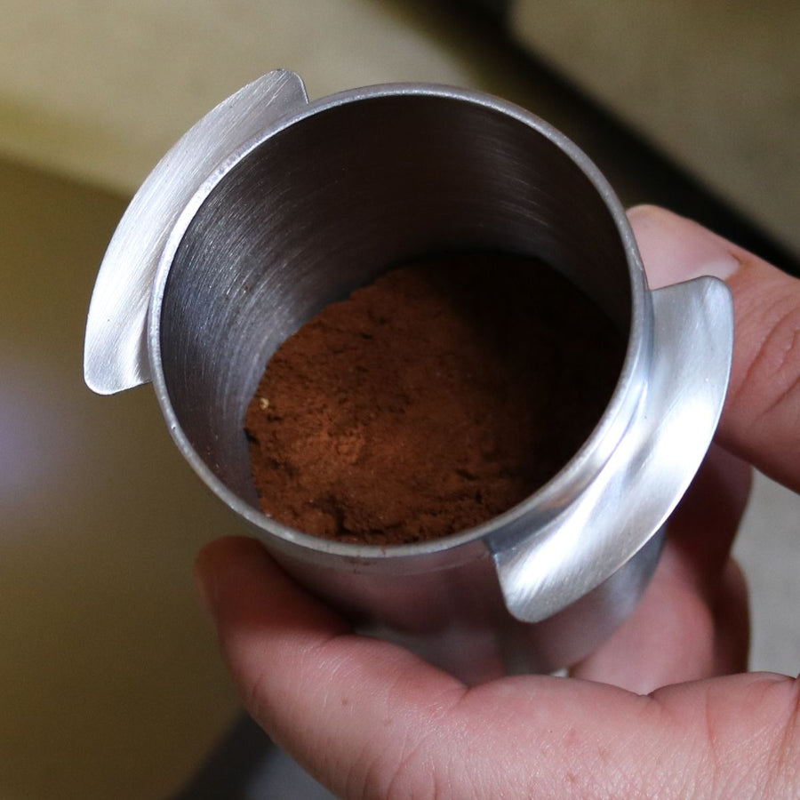 Rhino Coffee Gear Dosing Cup with coffee grinds
